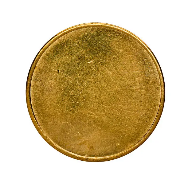 Photo of Single used blank brass coin, top view isolated on white