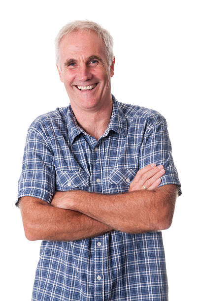 istock smiling mature man with arms crossed 157641300