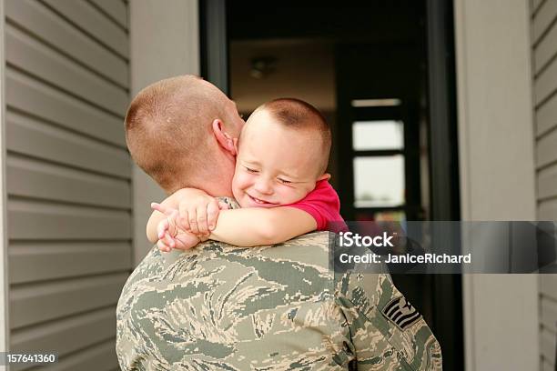 Happy Return Of Military Father Holding His Son Stock Photo - Download Image Now - Military, Family, Air Force