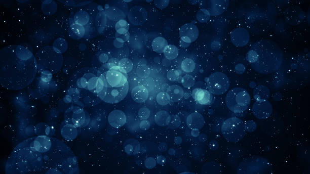 istock Particles Blue dust abstract light bokeh motion titles cinematic background 1576413818