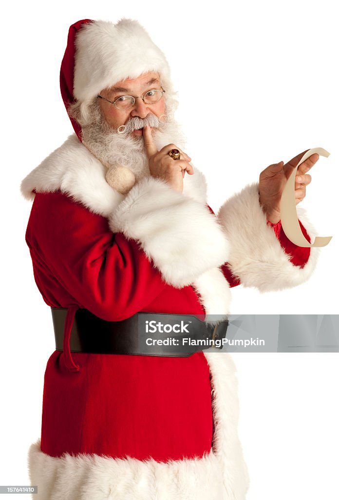 Santa Claus keeping a secret. White Background. This is a real-beard Santa that really looks the part, he has been doing this for more than 40 years! Santa Claus Stock Photo
