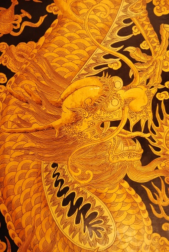 Picture of a sea dragon painted on a wooden door. It symbolically guards the entrance of the Thian Hock Keng Temple at Telok Ayer Street in Singapore. 