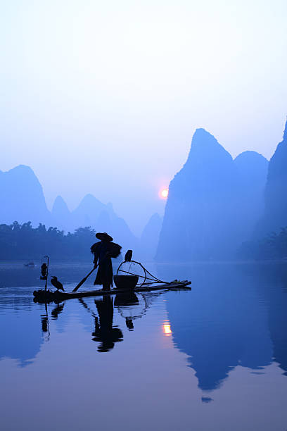 istock Fishermen fishing in china 157642089