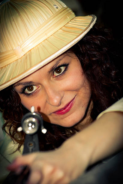 istock hunter woman shoots with her precision gun and hat 157642157