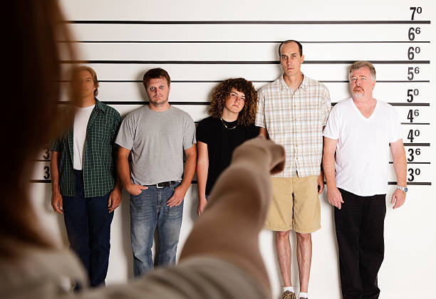istock Person Pointing at a Police Lineup 157642210