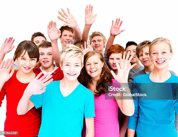Group Of Happy Teenagers Waving To You Against White Stock Photo - Download Image Now