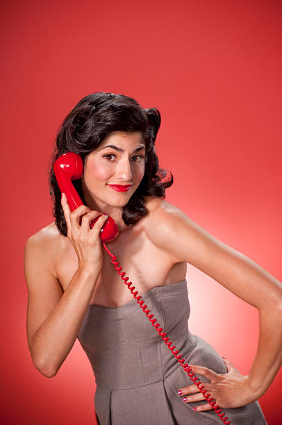 レトロな女性に電話 - kitsch telephone women old fashioned ストックフォトと画像