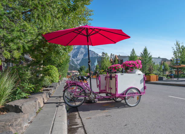 istock Pink Bicycle Ice-cream Carts in Banff 1576423356