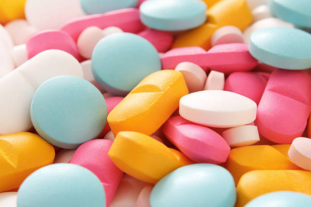 píldoras - pink pill fotografías e imágenes de stock