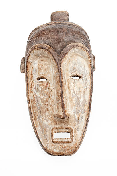 African mask isolated on white background Studio shot. Vertical format. White background. cameroon photos stock pictures, royalty-free photos & images