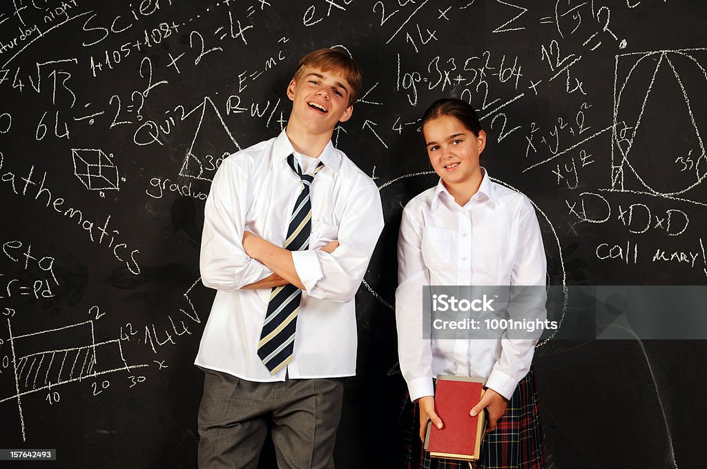 Students Students posing in front of the blackboard 16-17 Years Stock Photo