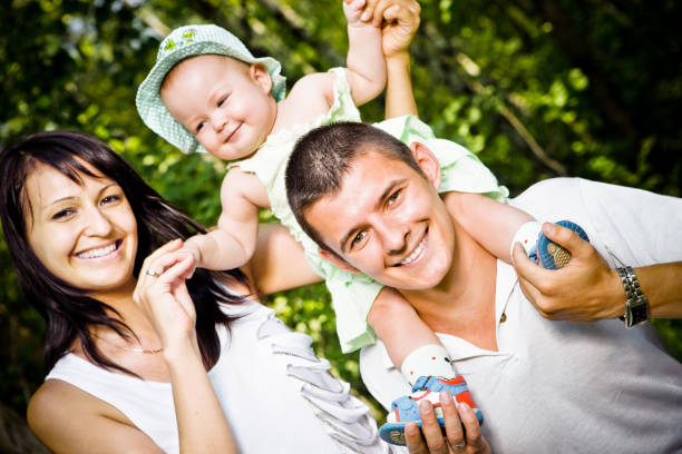 istock Happy Young Family enjoying summer in forest 157642494