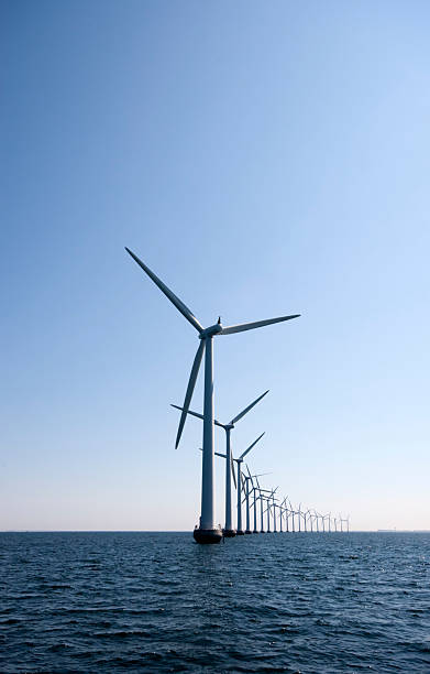 Windturbine in a row at the ocean outside Copenhagen stock photo