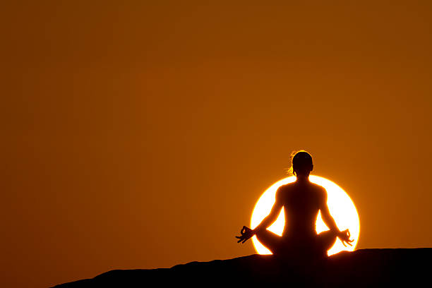 istock yoga in front of sunset 157642783