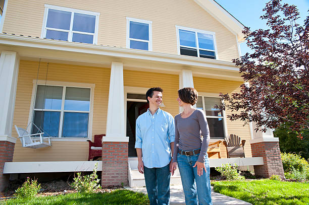 istock Happy couple outside of first home 157642952