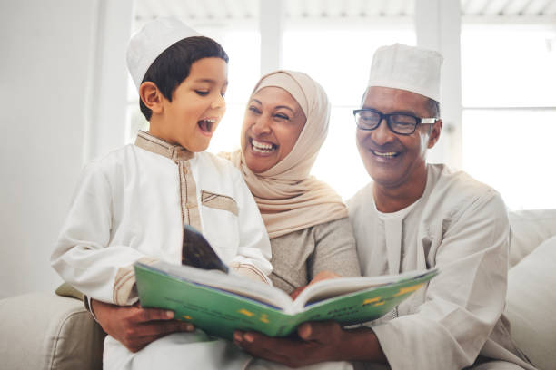Happy family, Muslim parents or child reading book for learning, Islamic knowledge or studying Allah. Support, funny father or Arabic mom laughing or teaching kid worship, prayer or religion at home Happy family, Muslim parents or child reading book for learning, Islamic knowledge or studying Allah. Support, father or Arab mom laughing or teaching kid worship, prayer or knowledge at family home father allah stock pictures, royalty-free photos & images