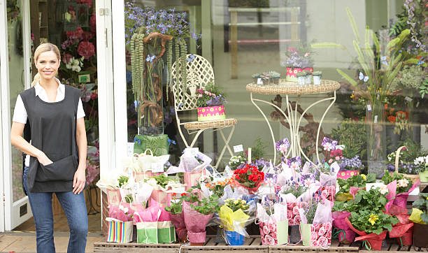 istock Female Florist Standing Outside Shop 157643071