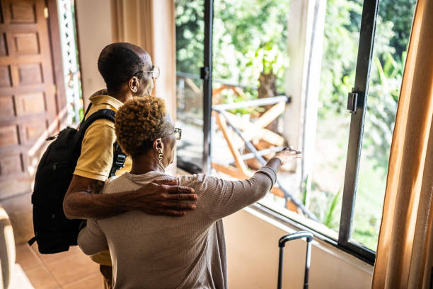 istock Senior couple looking at the view at a hotel 1576431189