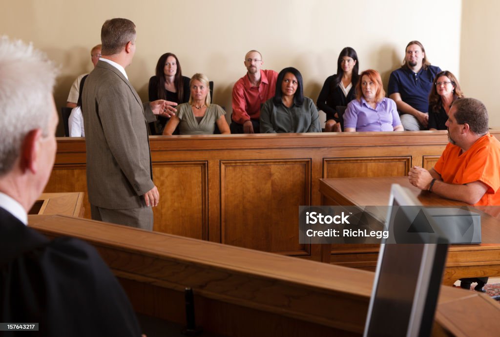 Lawyer Addressing the Jury A lawyer in a courtroom talking to the jury. Juror - Law Stock Photo