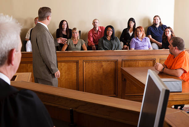 Lawyer Addressing the Jury A lawyer in a courtroom talking to the jury. legal trial stock pictures, royalty-free photos & images