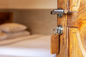 Old hotel room stock. Open old door to the hotel room.