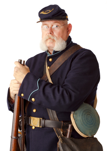 Re-enactor portraying an American Civil War Union Soldier. There is a lot of detail in this image.