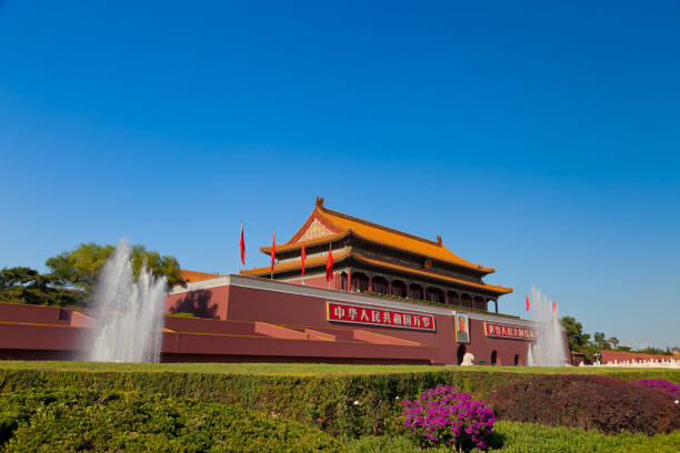 An editorial photo of the iconic Tiananmen Gate in Beijing, China, captured on October 10, 2023, showcasing the architecture, red flags, and surrounding area.