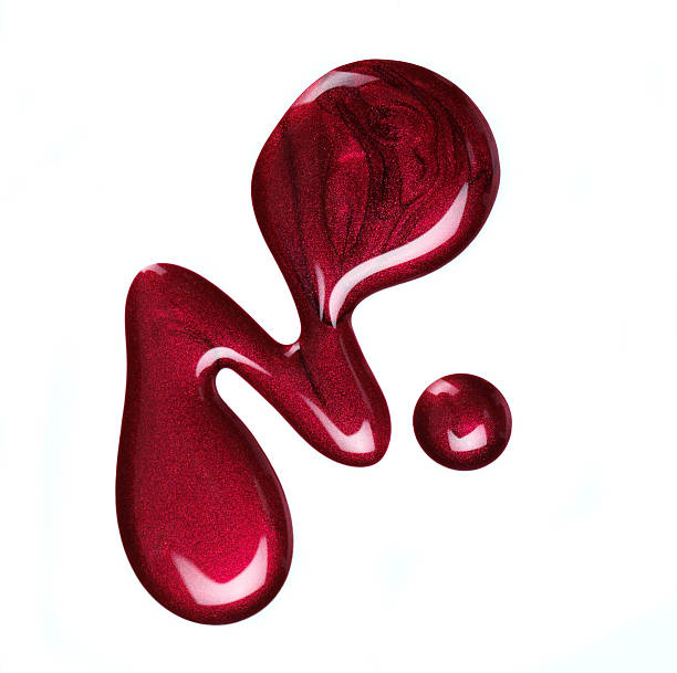 istock Some spilled red nail polish on a white background  157643598