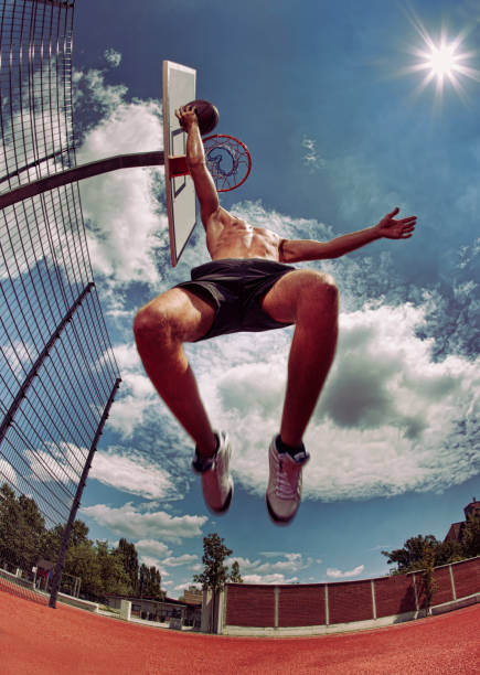 istock Young man about to slam dunk 157643756