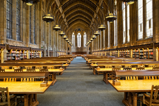 PROPERTY RELEASE ON FILE. University of Washington's crown jewel, Suzzallo Library. This view is of the renowned reading room whose complex interior is comparable to the nave of a cathedral (see other files in this series). Measuring 65 feet high, 52 feet wide, and 250 feet long, it features a vaulted ceiling elaborately decorated with rich color and gilded stenciling.  