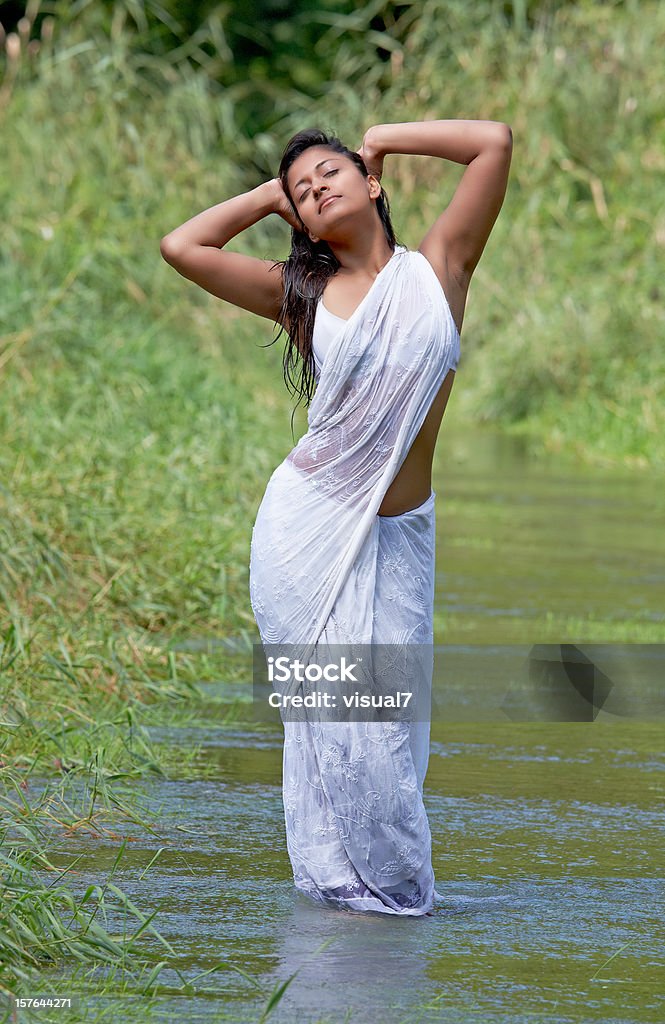 happy indian woman in a white sari  Culture of India Stock Photo