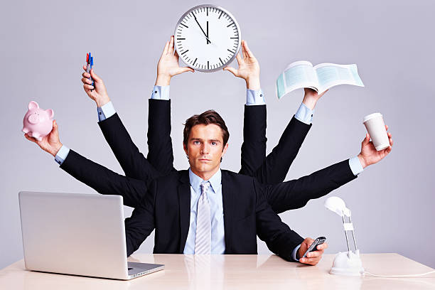 istock Confident business man multitasking at desk 157644306