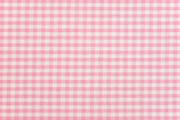 Photo of A pink gingham pattern fabric background