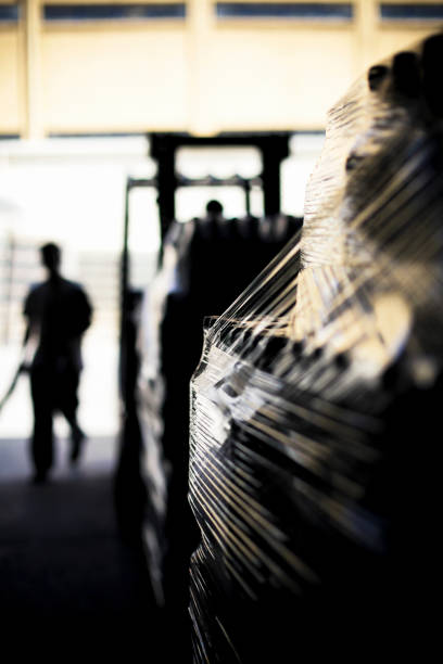 Warehouse Wine bottle packages and a forklift silhouette in a wine factory wine shipping stock pictures, royalty-free photos & images