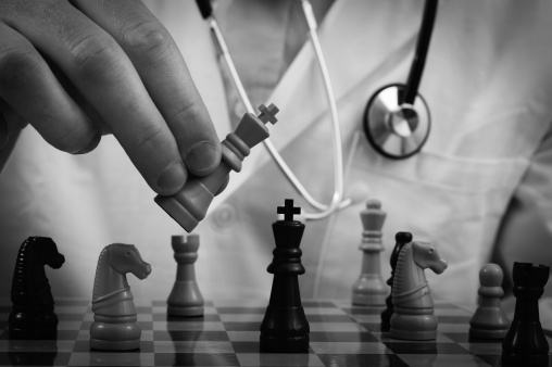 a medical doctor playing chess.