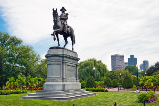 George Washington statue with office buildings in background