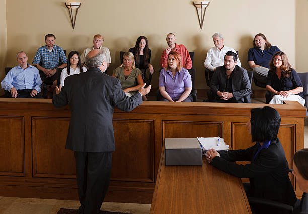 Lawyer Addressing the Jury A lawyer in a courtroom talking to the jury. juror stock pictures, royalty-free photos & images