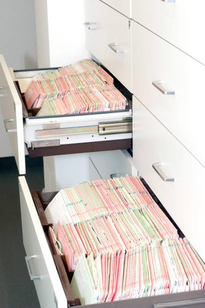 istock patient documents in drawer - medical record 157644684