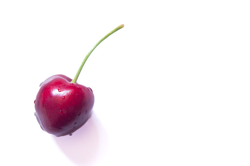 Cherry isolated on a white background. Top view, copy space.