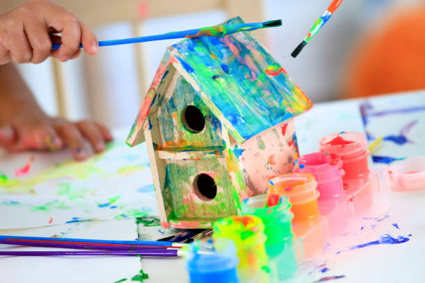 istock Painting a Birdhouse 157644912