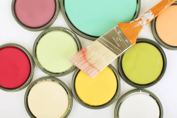 istock Used paintbrush on top of paint can lids 157644967