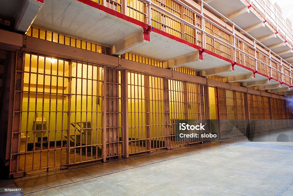 Rows of Prison Cells Rows of locked prison cells, Alcatraz, San Francisco, California. Bonus: ghost (see right-middle). Prison Stock Photo