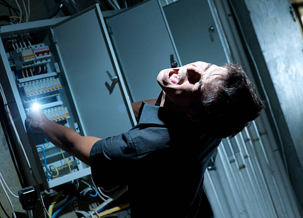 Man getting shocked by electricity on a breaker