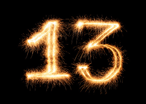 Sparkling number 13 on a pure black background. Can be used for birthdays, anniversaries.