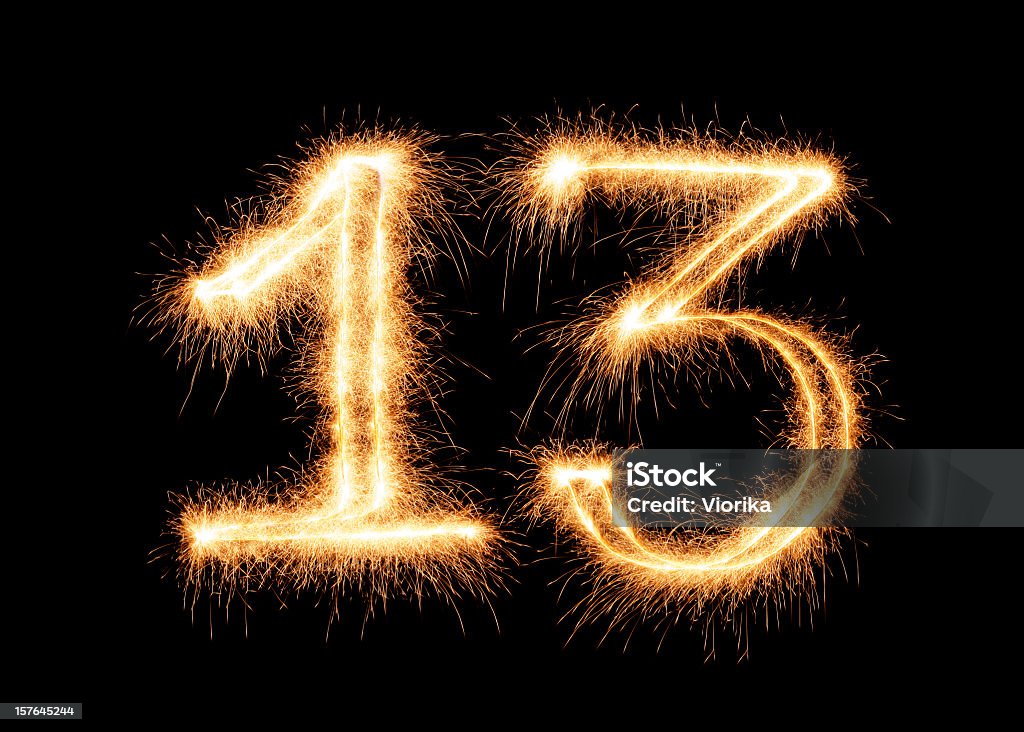 Number 13 outlined in festive sparkler lights Sparkling number 13 on a pure black background. Can be used for birthdays, anniversaries. Number 13 Stock Photo