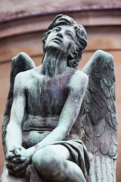 Photo of Bronze Angel on Old Tomb in Italy