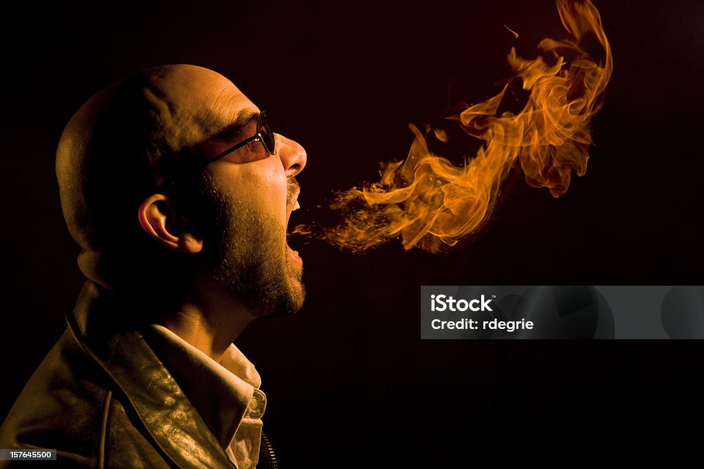 Man Breathing Fire, acidez estomacal, mal aliento, o enojo - Foto de stock de Mal aliento libre de derechos