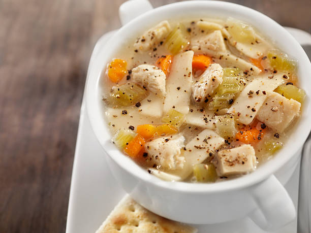 istock Chunky Chicken Noodle Soup with Saltine Crackers 157645528