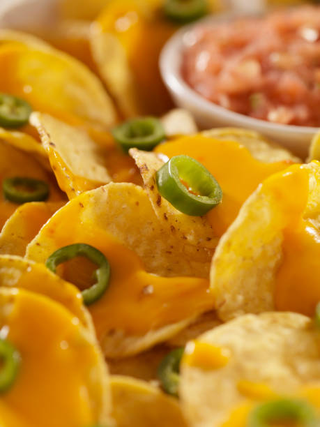 istock Nachos with Cheese Sauce, Jalapenos snd Salsa 157645572