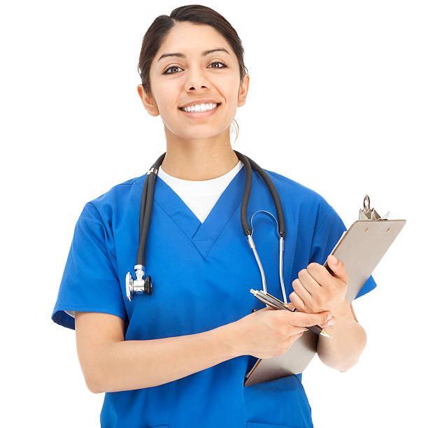 allegro giovane ispanica infermiere in blu scrub - female nurse nurse scrubs female doctor foto e immagini stock